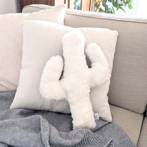 Creamy white plush cactus pillow